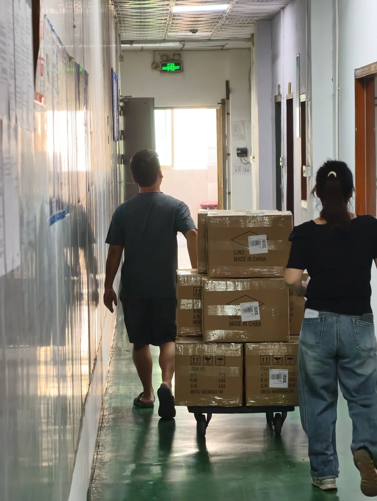Warehouse staff moving cartons to dispatch